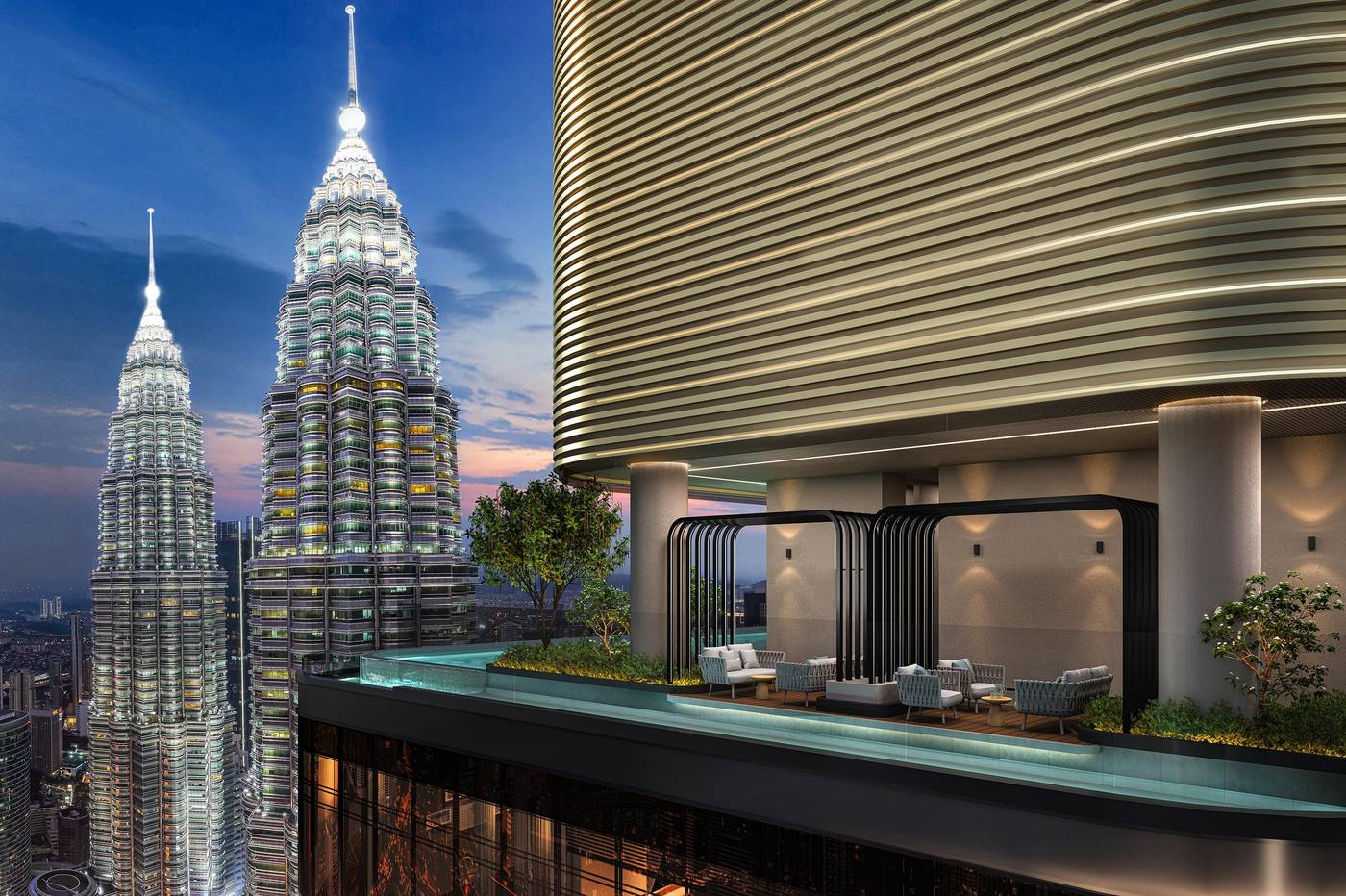 CloutHaus terrace overlooking Petronas Twin Towers at dusk