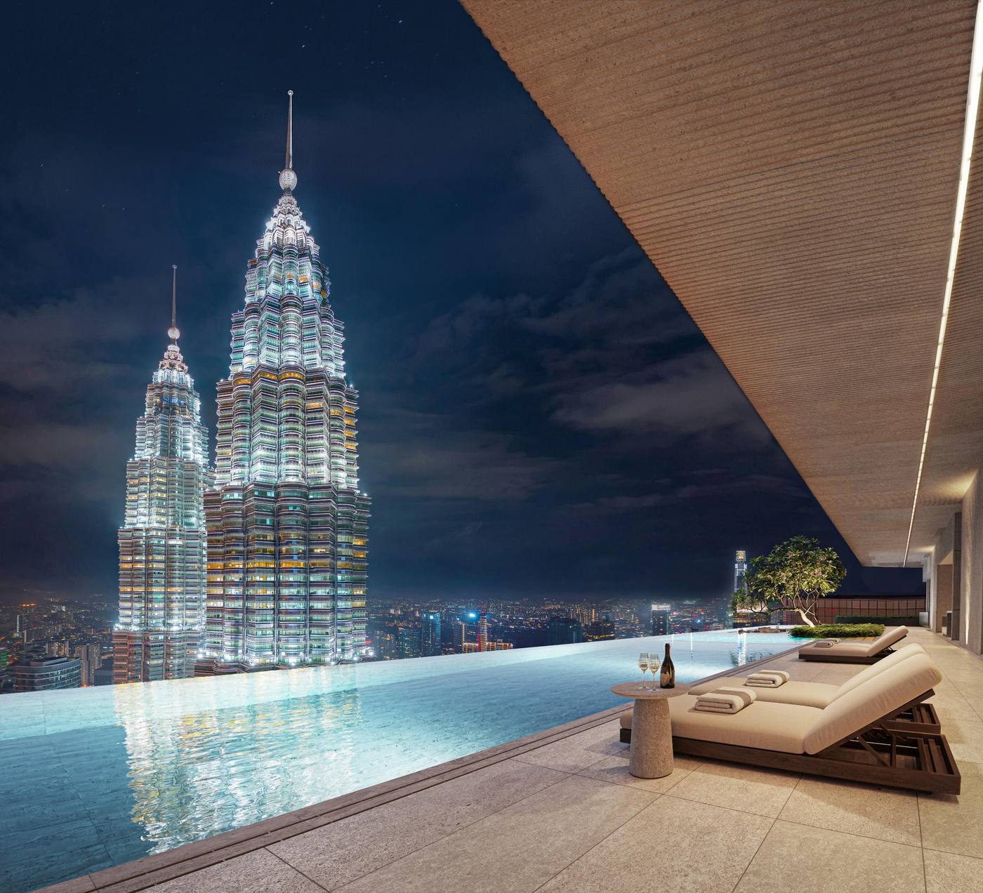 CloutHaus Infinity Sky Pool overlooking Petronas Twin Towers at night